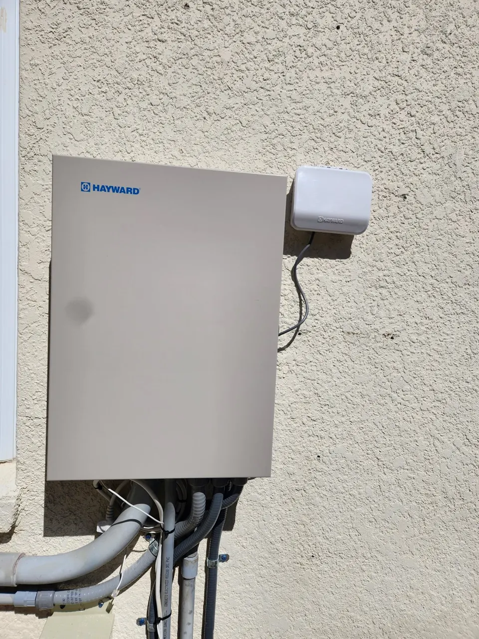 Hayward pool automation panel mounted on a wall in Brooksville