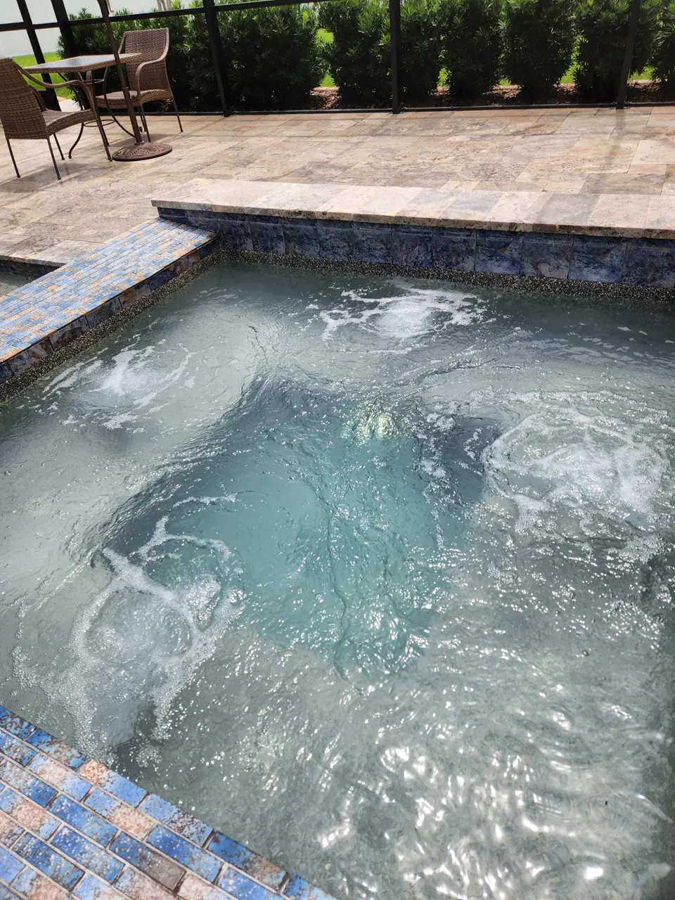 Attached spa with new LED lighting at a Spring Hill pool