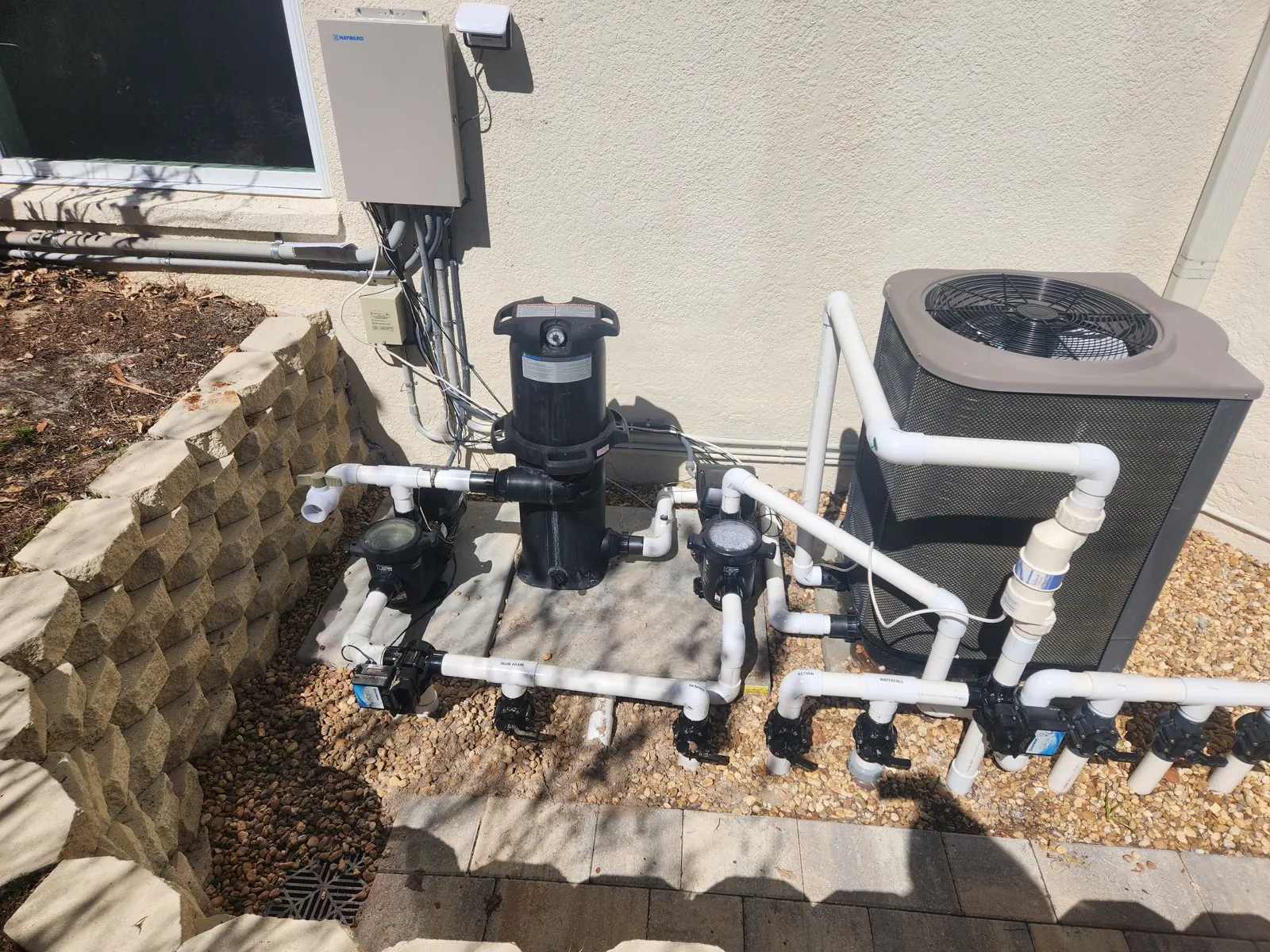 Rebuilt pool equipment pad with new pump, filter, valves and heat pump in Brooksville